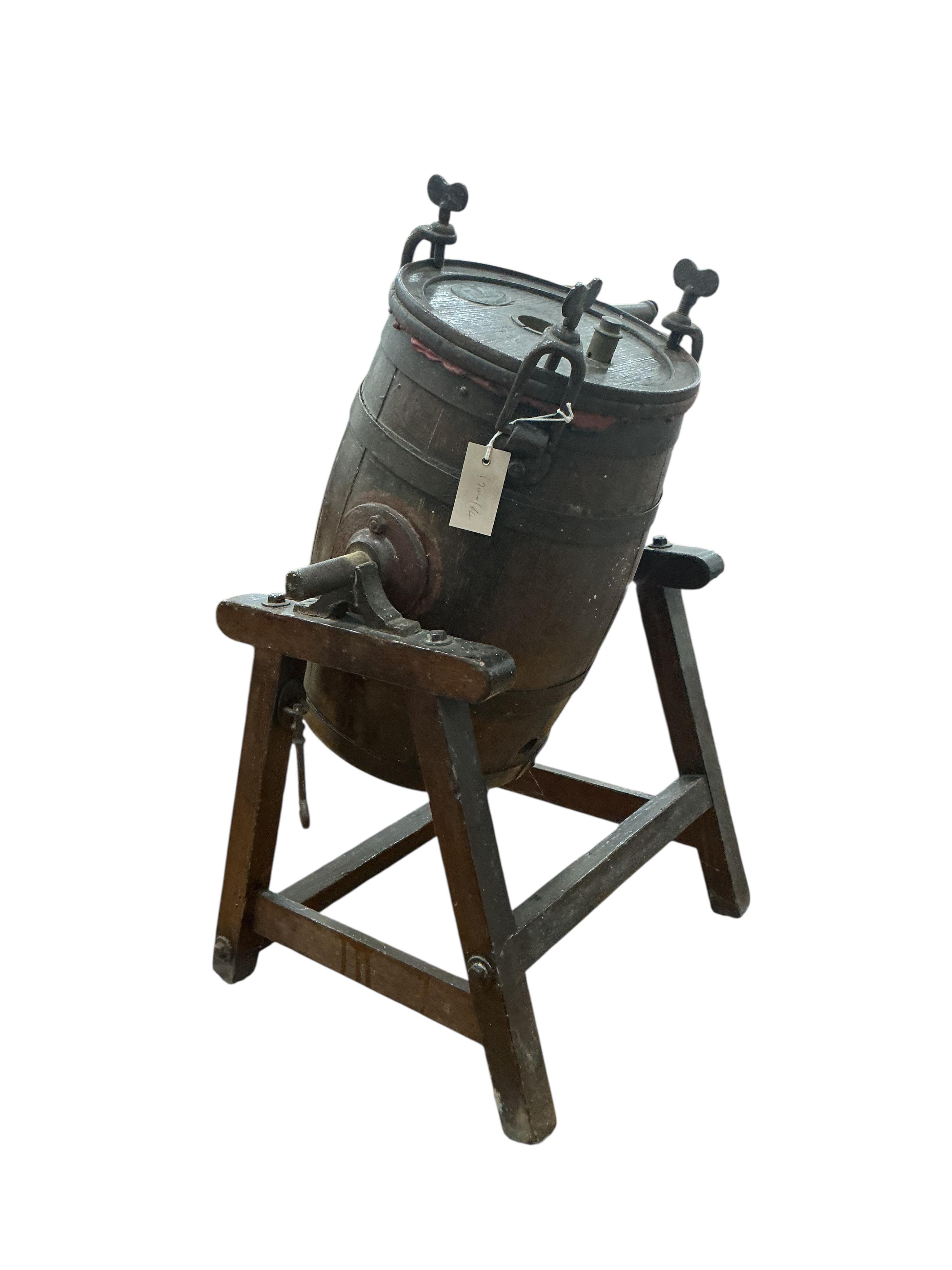 A Victorian Waide & Sons iron bound staved oak butter churn on stand
